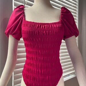 Elegant Magenta Smocked 1pc bathing suit.